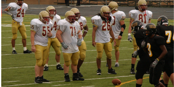 AZMM Blog Graphic on college athlete influencers College football players on field.